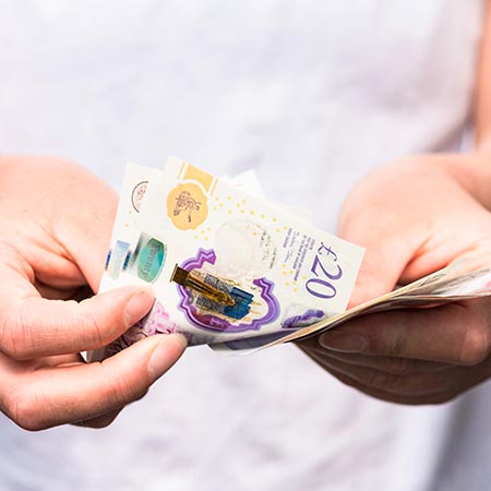 Girl checking banknotes