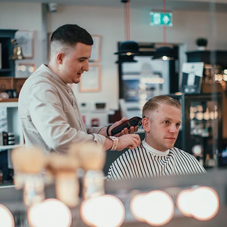 Barber cutting hair