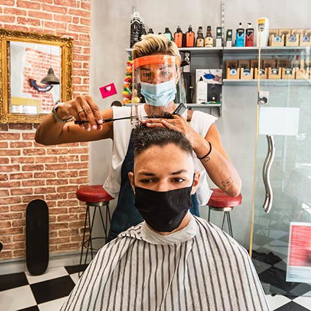 Barber wearing PPE