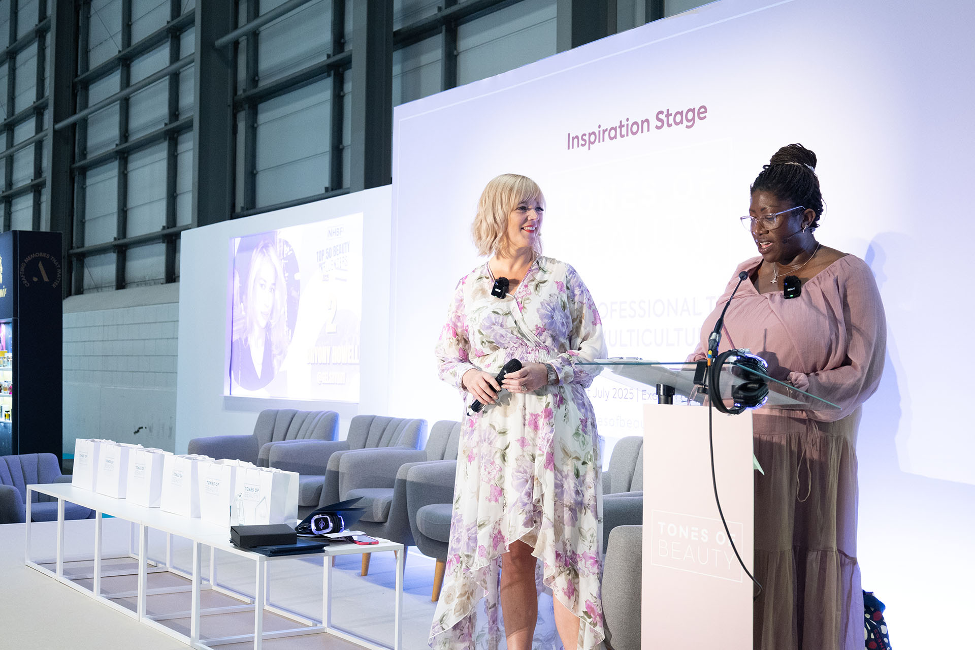 Caroline Larissey with the winner at the NHBF Top 50 Beauty Influencers Awards, celebrating their achievement at the event.
